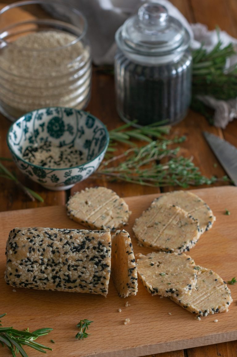 Cutting the wicks from crackers dough with cheese and herbs